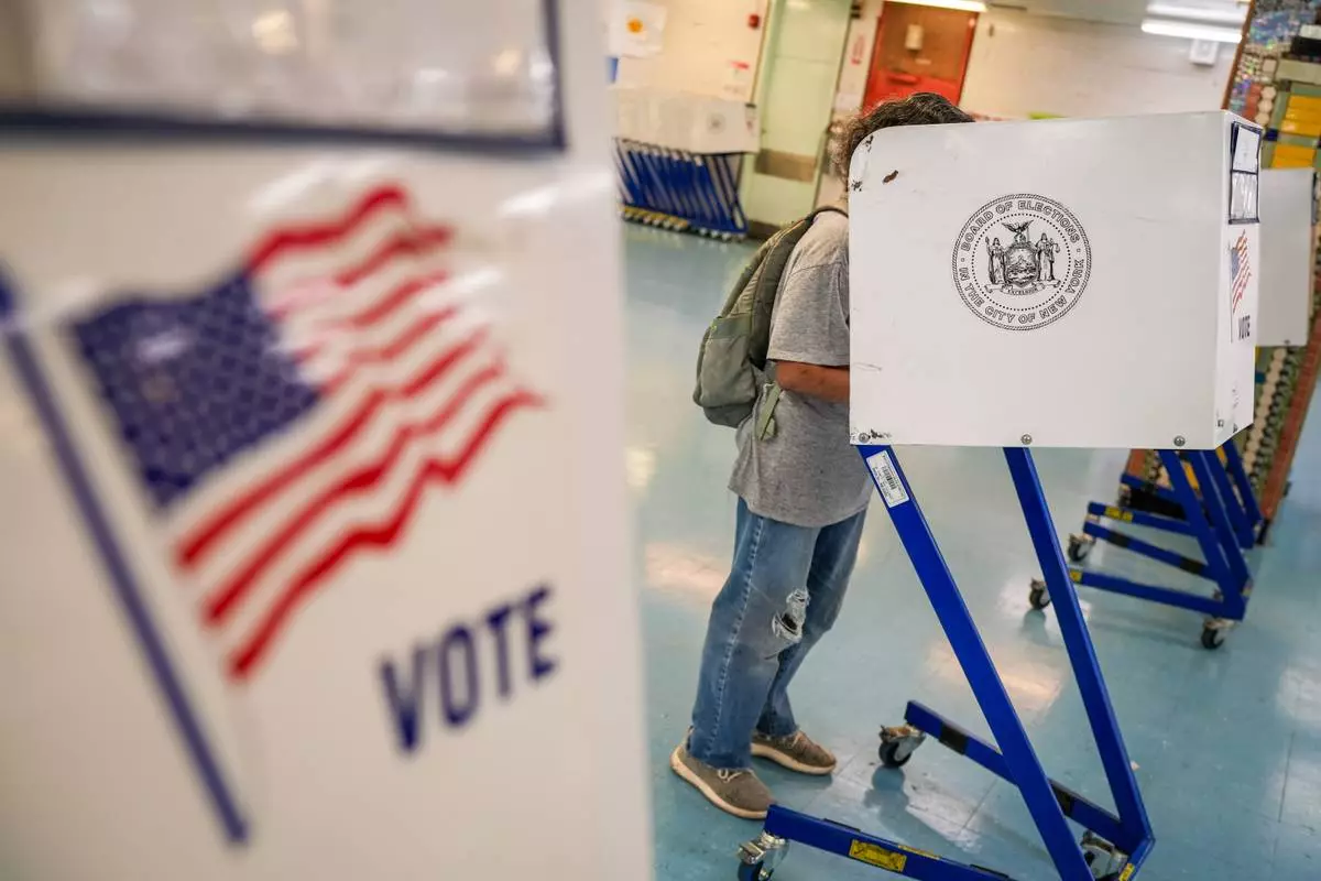 A voter casts a ballot during New York’s primary election on Tuesday, June 23, 2026, in New York. (AP Photo/Ryan Murphy)