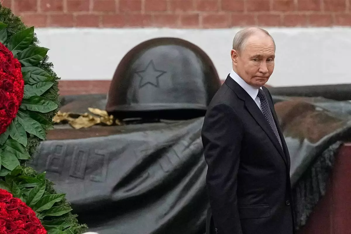 Russian President Vladimir Putin attends a wreath-laying ceremony marking the 85th anniversary of the Nazi German invasion into Soviet Union in World War II on the Remembrance and Sorrow Day at the Tomb of the Unknown Soldier by the Kremlin wall in Moscow, on Monday, June 22, 2026. (AP Photo/Alexander Zemlianichenko, Pool)