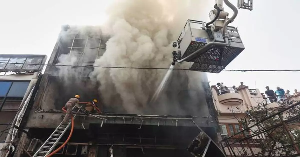 Fire tears through building in northern India, killing 14, mostly students
