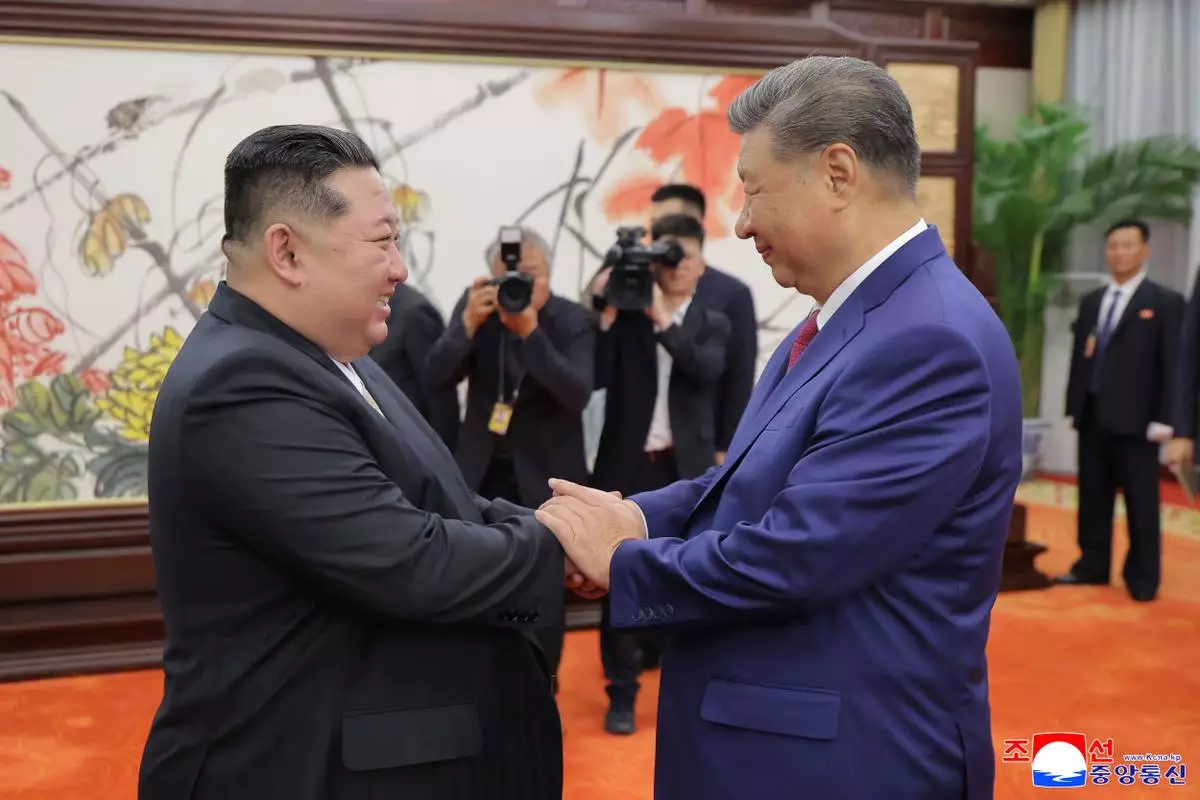 FILE - In this photo provided by the North Korean government, North Korean leader Kim Jong Un, left, shakes hands with Chinese President Xi Jinping in Beijing Thursday, Sept. 4, 2025. Independent journalists were not given access to cover the event depicted in this image distributed by the North Korean government. The content of this image is as provided and cannot be independently verified. Korean language watermark on image as provided by source reads: "KCNA" which is the abbreviation for Korean Central News Agency. (Korean Central News Agency/Korea News Service via AP, File)