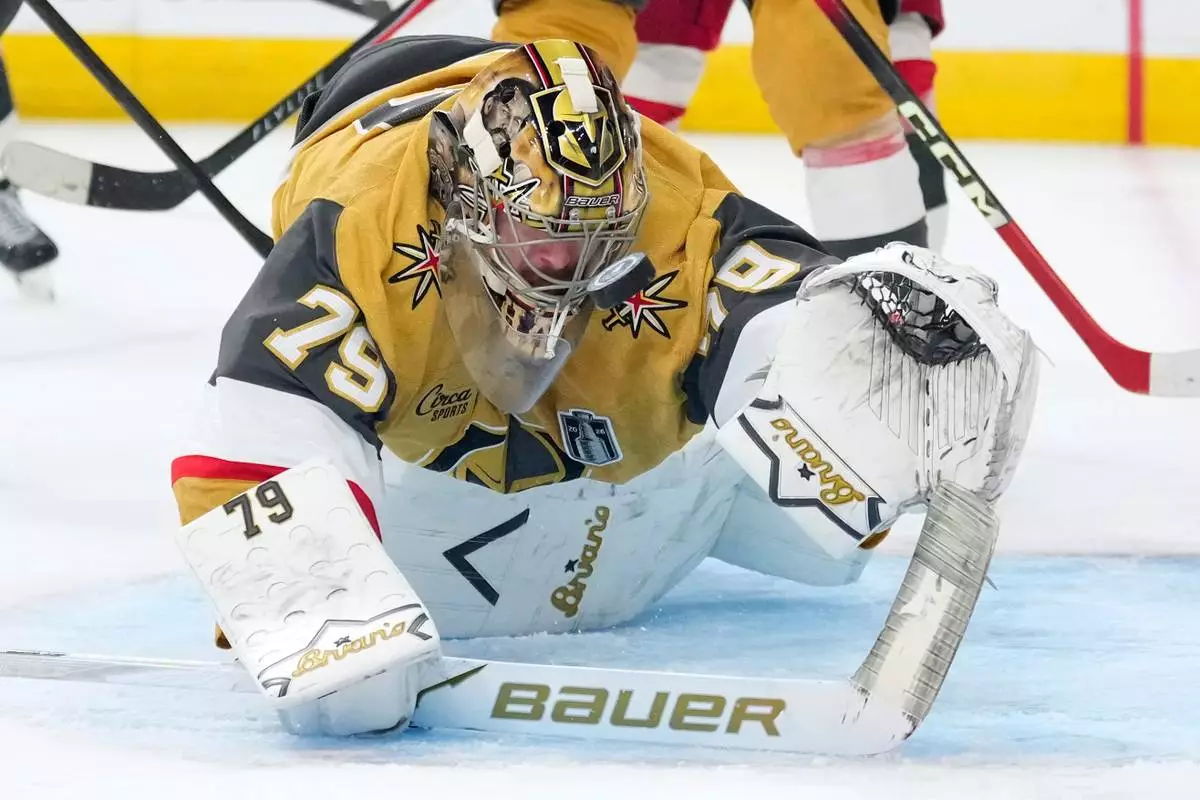 Vegas Golden Knights goaltender Carter Hart is scored on by Carolina Hurricanes center Jordan Staal during the third period in Game 4 of the NHL hockey Stanley Cup Final series Tuesday, June 9, 2026, in Las Vegas. (AP Photo/John Locher)