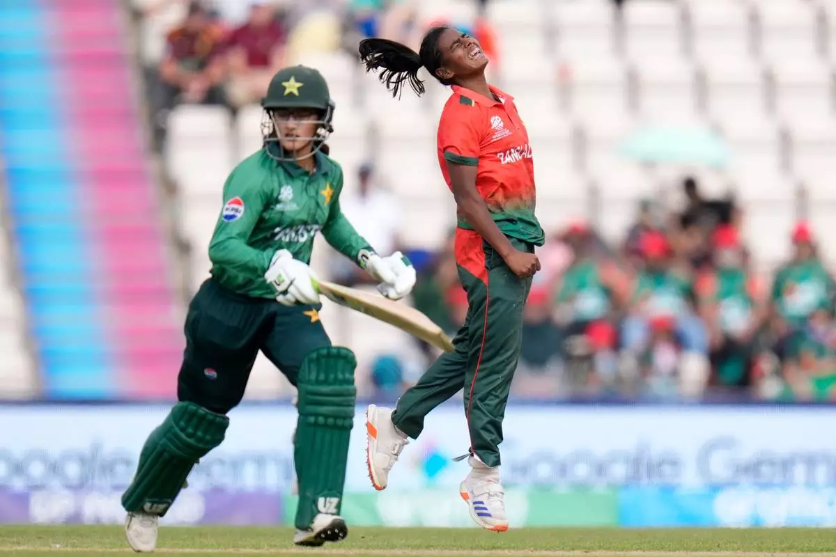 Marufa Akter of Bangladesh (right) reacts after bowling during the ICC Women's T20 World Cup match between Pakistan and Bangladesh, at the Hampshire Bowl, Southampton, England, Saturday June 20, 2026. (Andrew Matthews/PA via AP)