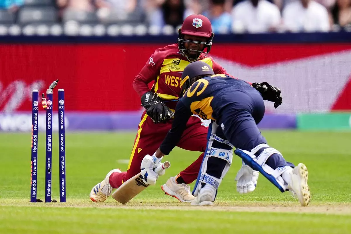 West Indies wicket keeper Shemaine Campbelle stumps out Sri Lanka's Sugandika Kumari during the ICC Women's T20 World Cup match between Sri Lanka and West Indies, in Manchester, England, Sunday, June 21, 2026. ( Jacob King/PA via AP)