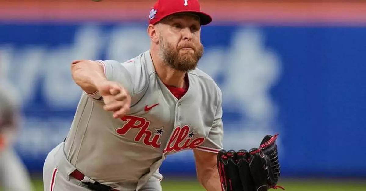 Hill makes incredible grab as Wheeler pitches Phillies to 2-1 win after Mets fire manager