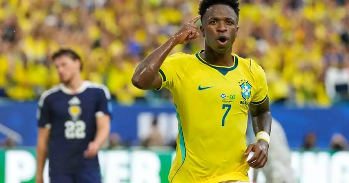 Vinícius Júnior scores 2 goals as Brazil beats Scotland 3-0 to win its World Cup group