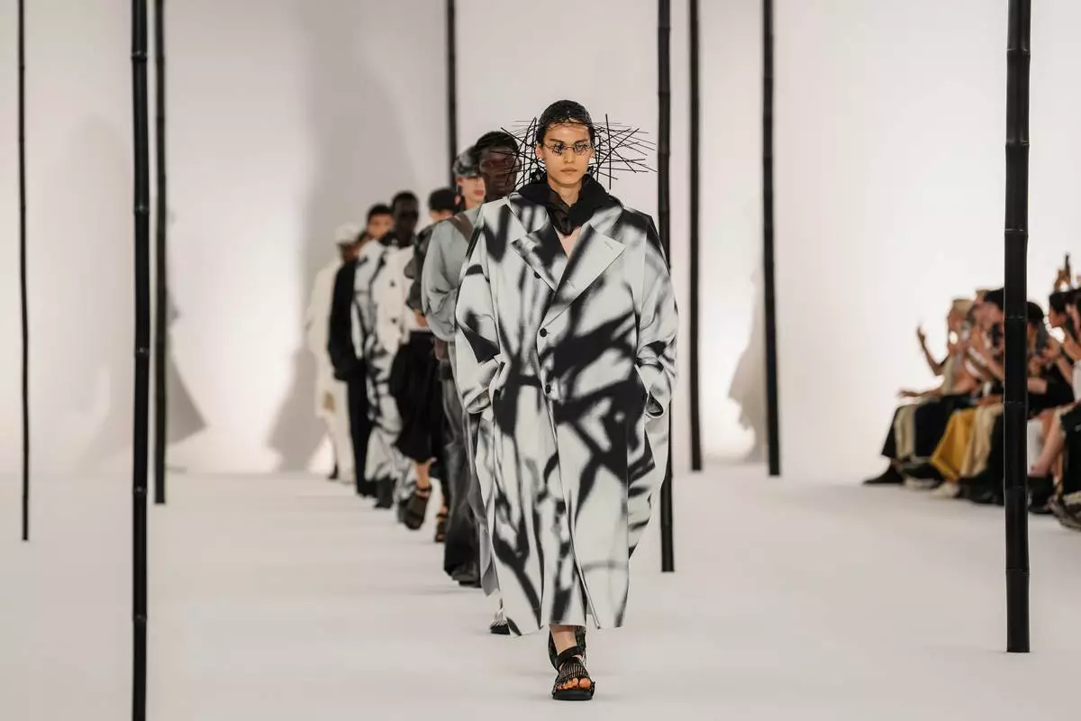 Models wear creations as part of the Issey Miyake Homme Spring Summer 2027 collection presented in Paris, France, Thursday, June 25, 2026. (AP Photo/Aurelien Morissard)