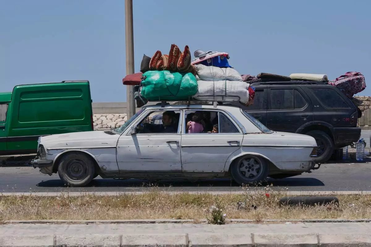 FILE - A Lebanese displaced family who fled their village in south Lebanon, arrive in the southern port city of Sidon, Lebanon, Wednesday, June 10, 2026. (AP Photo/Mohammed Zaatari, File)