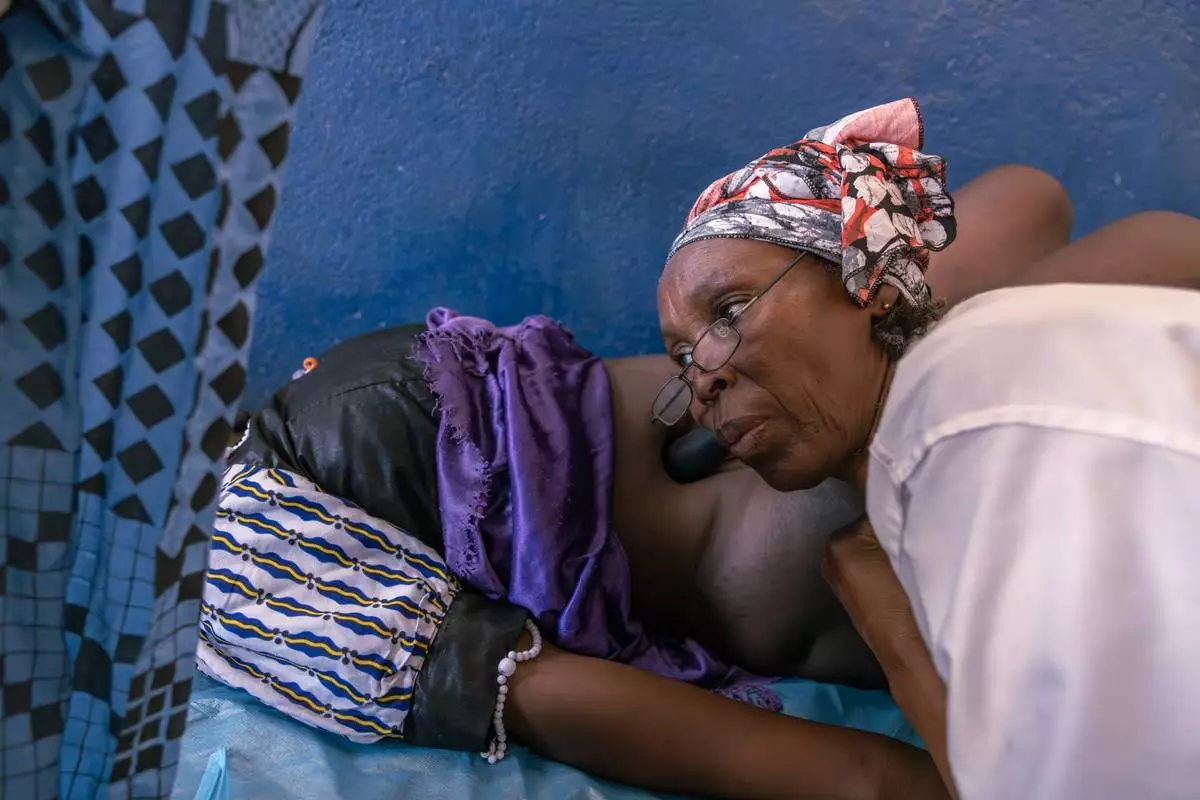 A woman has her first pre-natal consultation with nurse Delphine Zanabe at the Birao District Hospital in Central African Republic, Thursday, March 26, 2026. (AP Photo/Caitlin Kelly)