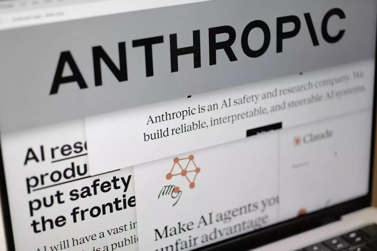 FILE - Pages from the Anthropic website and the company's logo are displayed on a computer screen in New York, Feb. 26, 2026. (AP Photo/Patrick Sison, File)