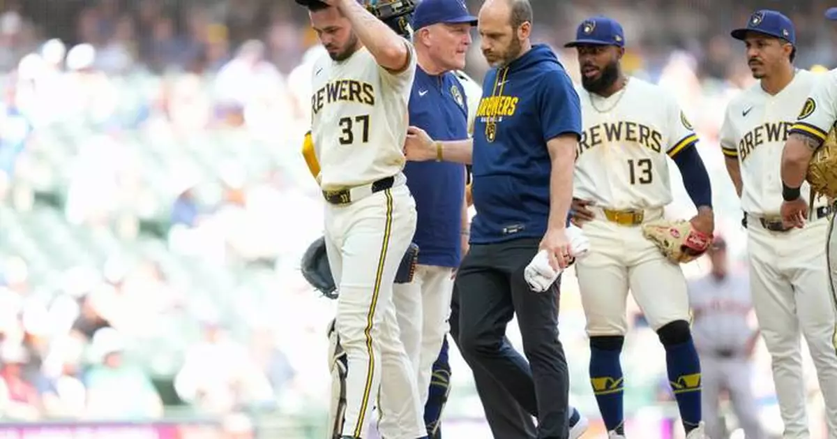 Brewers place DL Hall on injured list and designate Jake Woodford for assignment