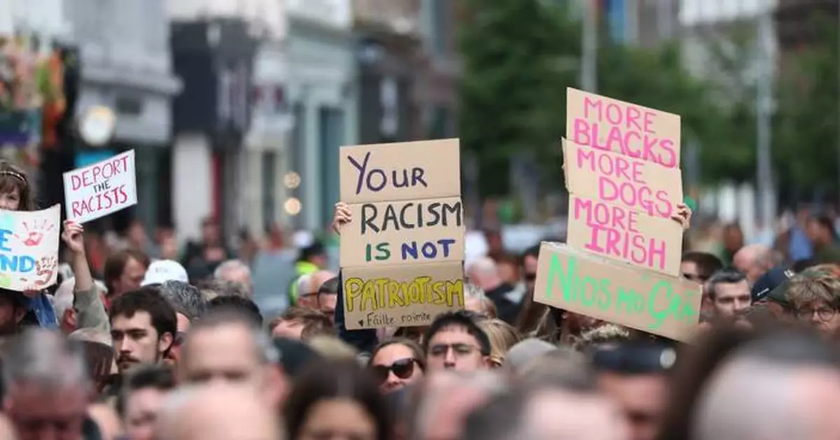 Thousands rally in Belfast to condemn anti-immigrant rioting that followed stabbing