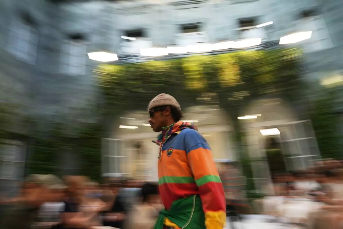 A model wears a creation as part of the Ralph Lauren Spring/Summer 2027 men's collection presented in Milan, Italy, Friday, June 19, 2026. (AP Photo/Antonio Calanni)