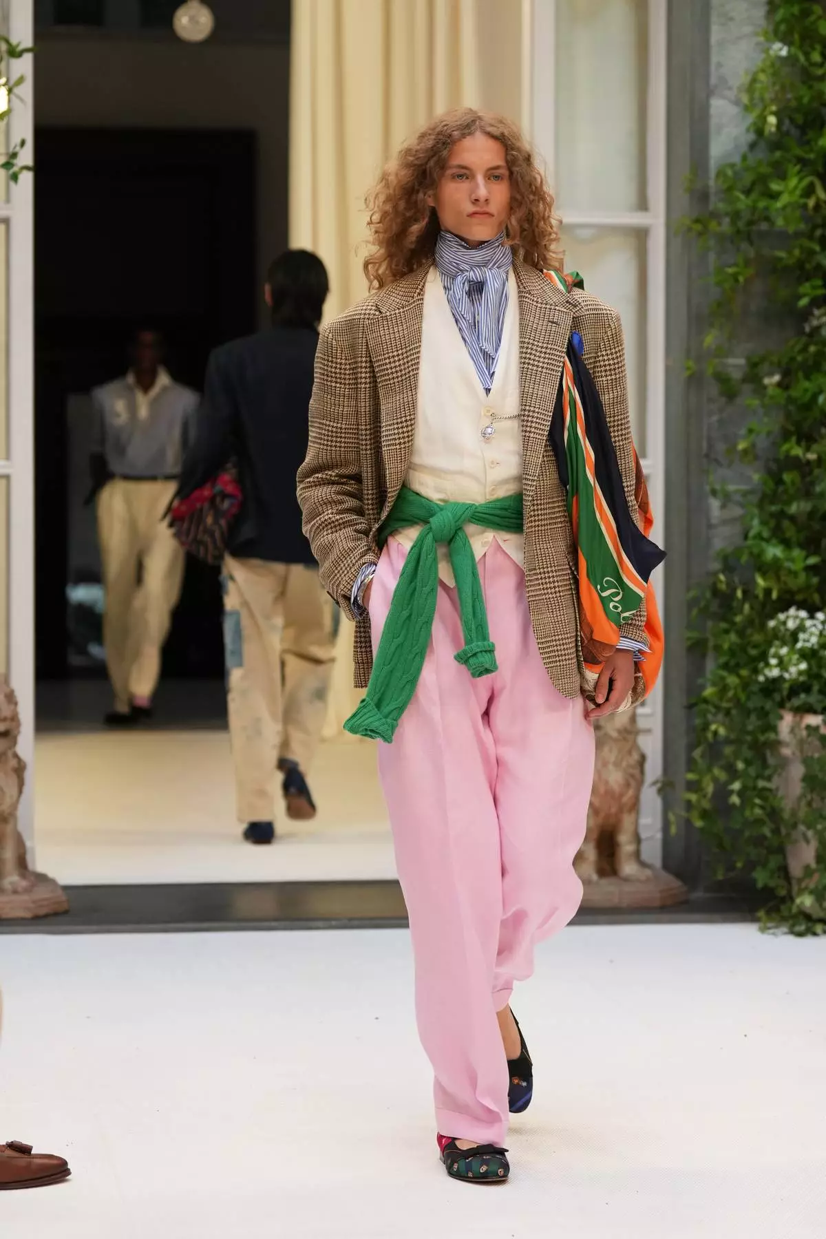 A model wears a creation as part of the Ralph Lauren Spring/Summer 2027 men's collection presented in Milan, Italy, Friday, June 19, 2026. (AP Photo/Antonio Calanni)