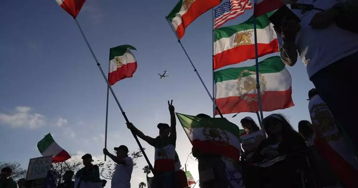 Iranian Americans protest for change outside Iran's World Cup match, in photos