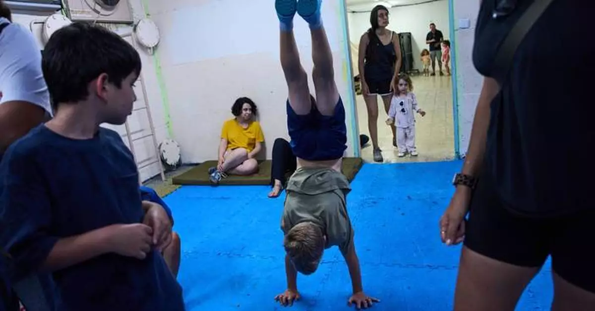 After morning of sirens, Israelis fall back into well-worn war routines