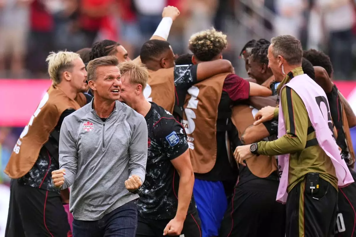 Canada head coach Jesse Marsch celebrates after Stephen Eustaquio scored their opening goal against South Africa during the World Cup round of 32 soccer match in Inglewood, Calif., near Los Angeles, Sunday, June 28, 2026. (AP Photo/Andre Penner)