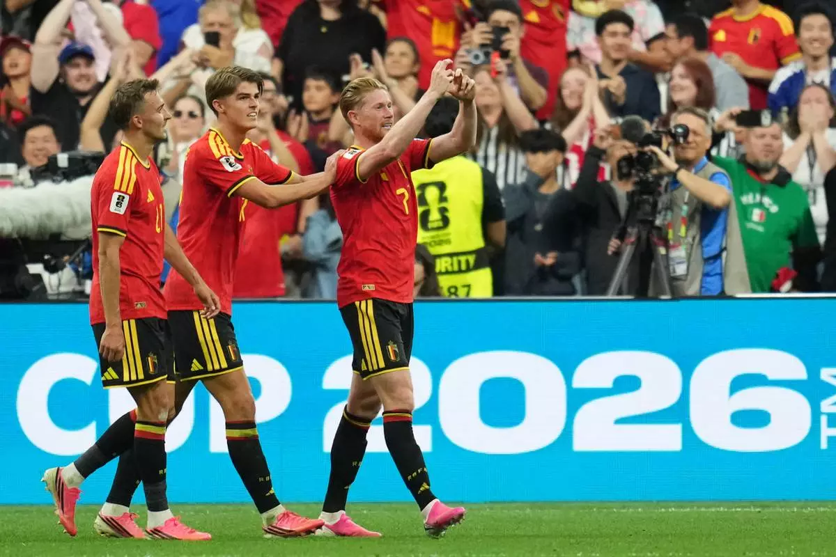 Belgium's Kevin De Bruyne (7) celebrates with teammates after scoring his team's third goal during the World Cup Group G soccer match between New Zealand and Belgium in Vancouver, British Columbia, Friday, June 26, 2026. (AP Photo/Abbie Parr)