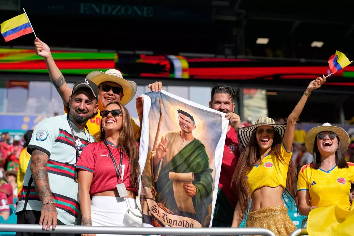 Colombia and Portuguese supporters react before the World Cup Group K soccer match between Colombia and Portugal in Miami Gardens, Fla., Saturday, June 27, 2026. (AP Photo/Lynne Sladky)