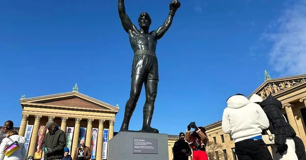Brazilian soccer fans at the World Cup heed warning not to dress Rocky statue in team gear