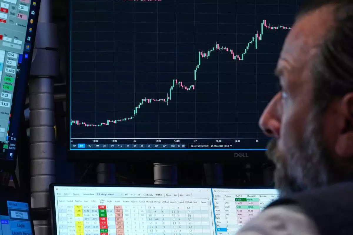 Specialist Michael Pistillo works at his post on the floor of the New York Stock Exchange, Friday, May 29, 2026. (AP Photo/Richard Drew)