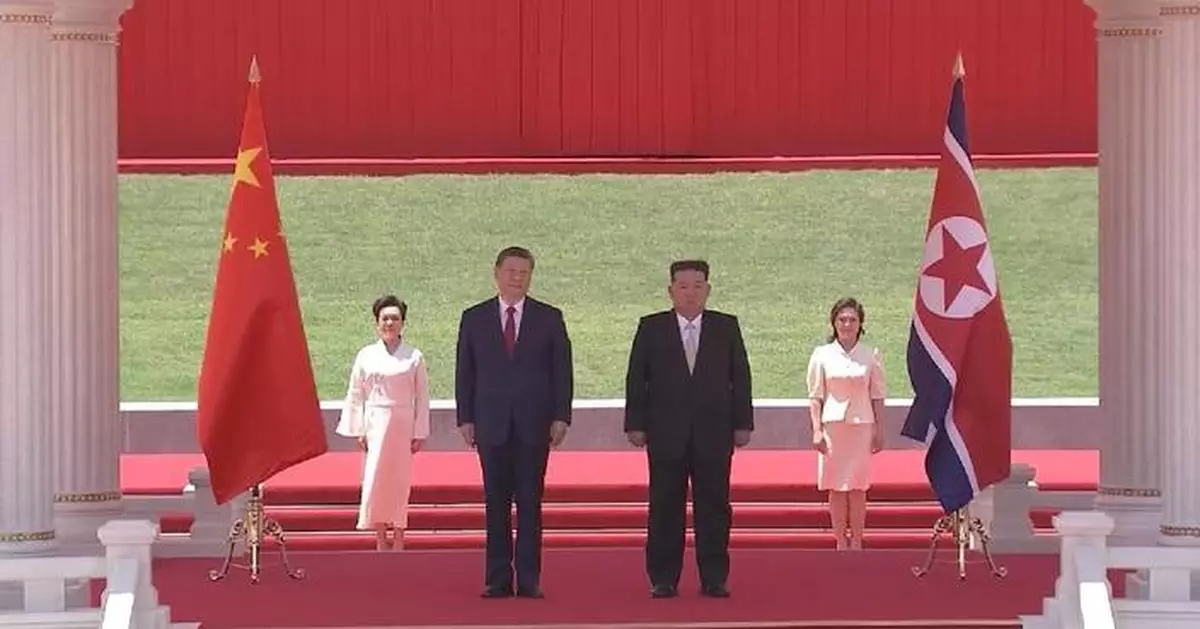 Xi attends grand welcome ceremony hosted by Kim in Pyongyang