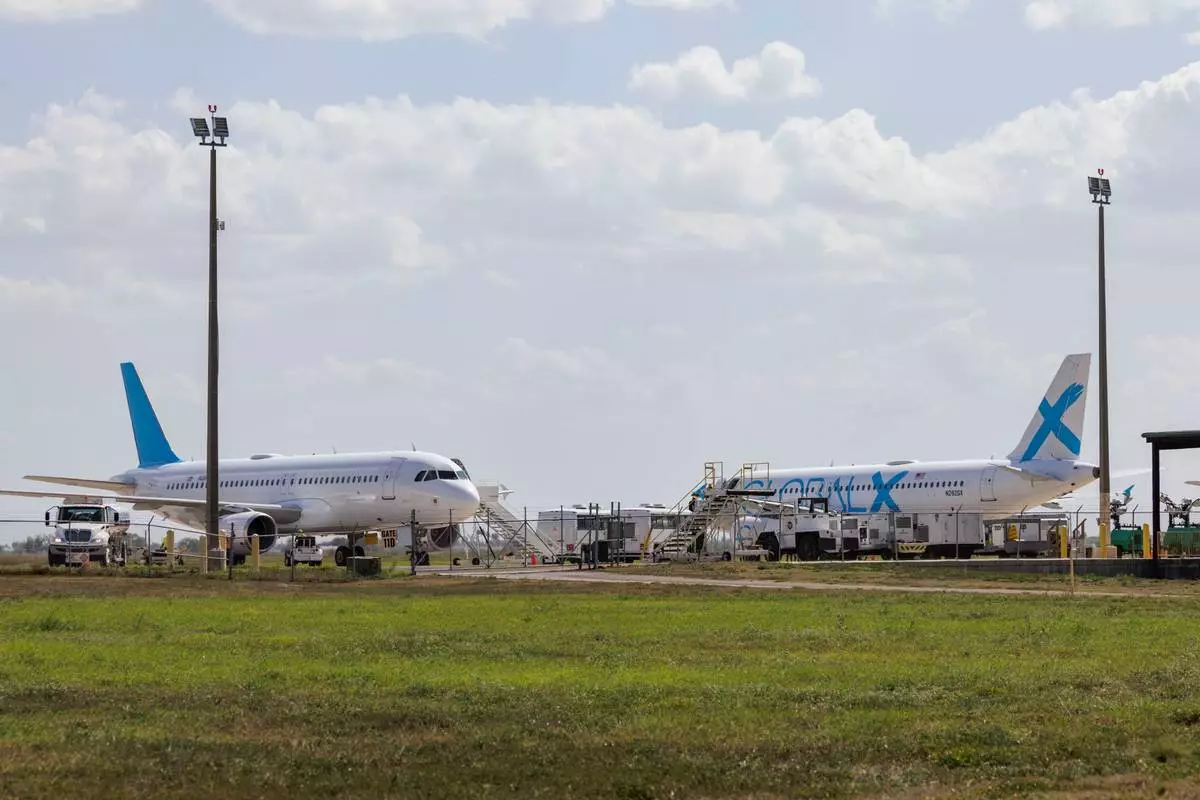 FILE - Planes used for deportation flights sit at the Valley International Airport, Aug. 31, 2025, in Harlingen, Texas. (AP Photo/Michael Gonzalez, File)