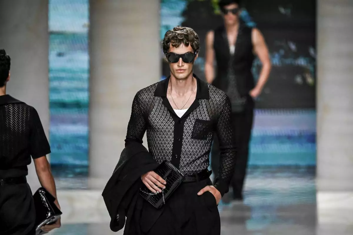 A model wears a creation from the Dolce & Gabbana Spring/Summer 2027 Men's collection presented in Milan, Italy, Saturday, June 20, 2026. (AP Photo/Nicola Marfisi)