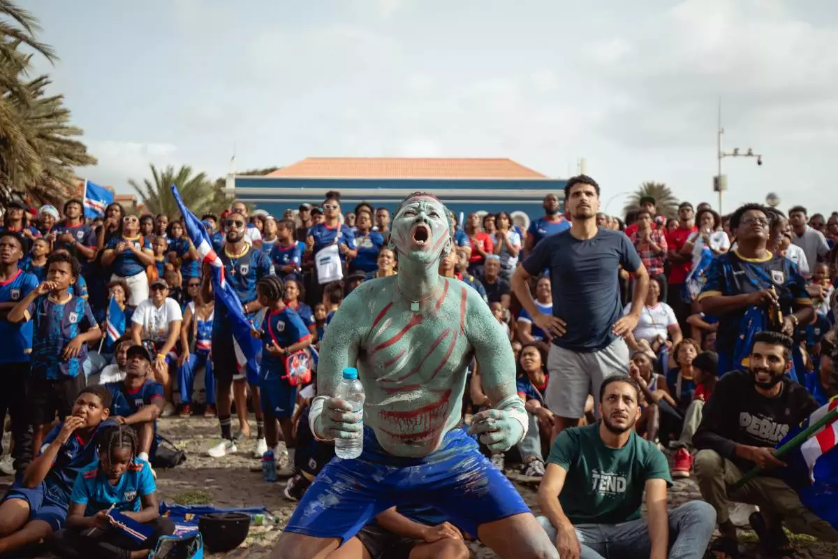 A fan reacts as he watches a broadcast of the World Cup Group H soccer match between Cape Verde and Spain at a viewing center in Mindelo, São Vicente, Cape Verde, Monday, June 15, 2026. (AP Photo/Queila Fernandes)