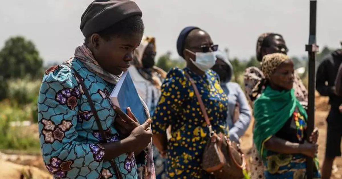 Mourners bury a 6-month-old Ebola victim in the Congo outbreak's 3rd orphanage death