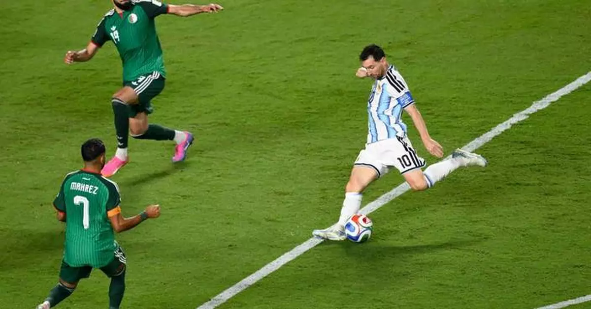 Messi has his first World Cup hat trick as defending champion Argentina beats Algeria 3-0 in opener