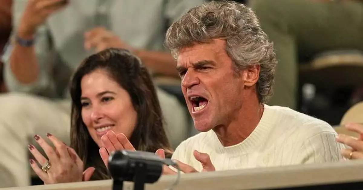 Gustavo Kuerten cheers as fellow Brazilian Joao Fonseca follows in his footsteps at the French Open