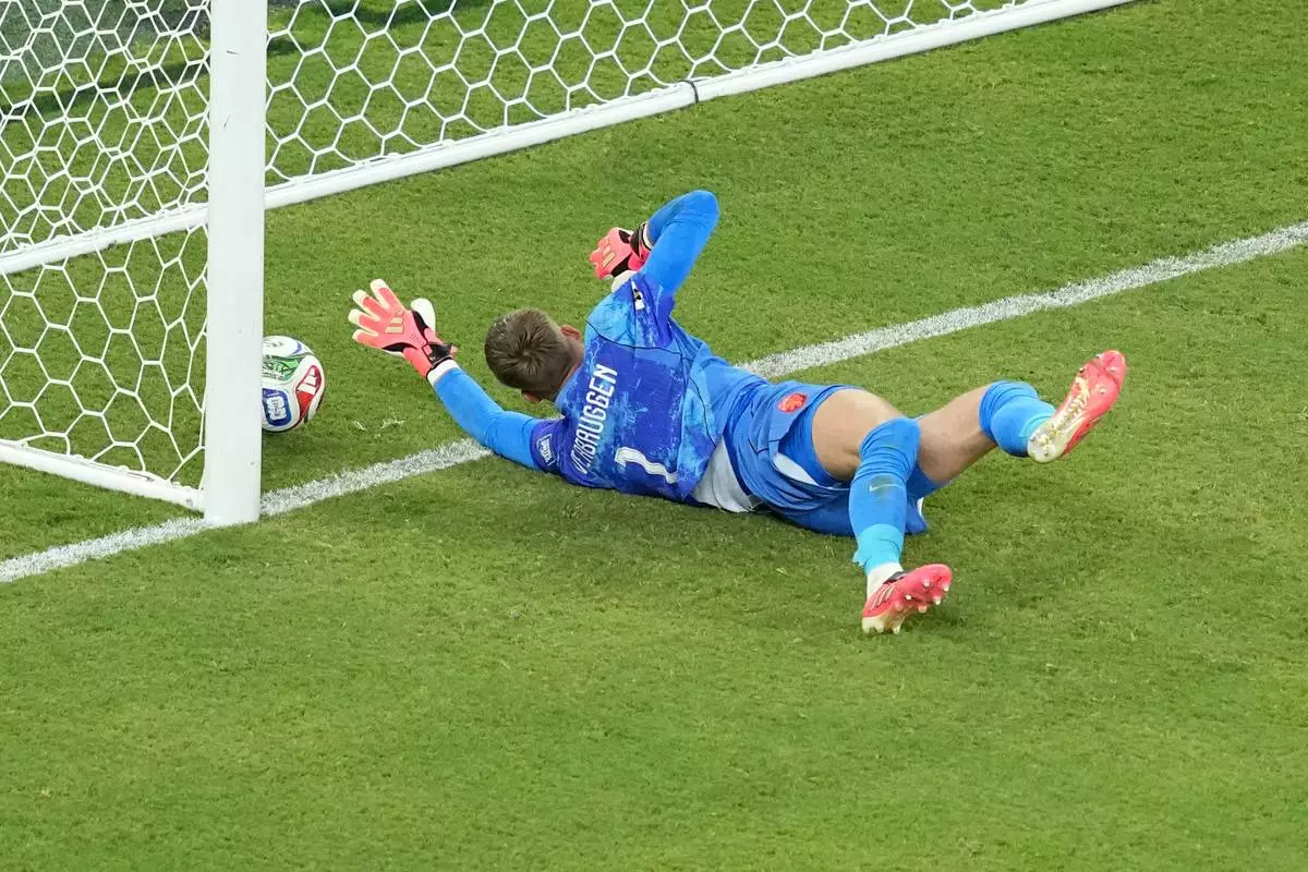 Netherlands goalkeeper Bart Verbruggen (1) allows a goal during a penalty shootout at the end of the World Cup round of 32 soccer match between the Netherlands and Morocco in Guadalupe, near Monterrey, Mexico, Monday, June 29, 2026. (AP Photo/Moises Castillo)