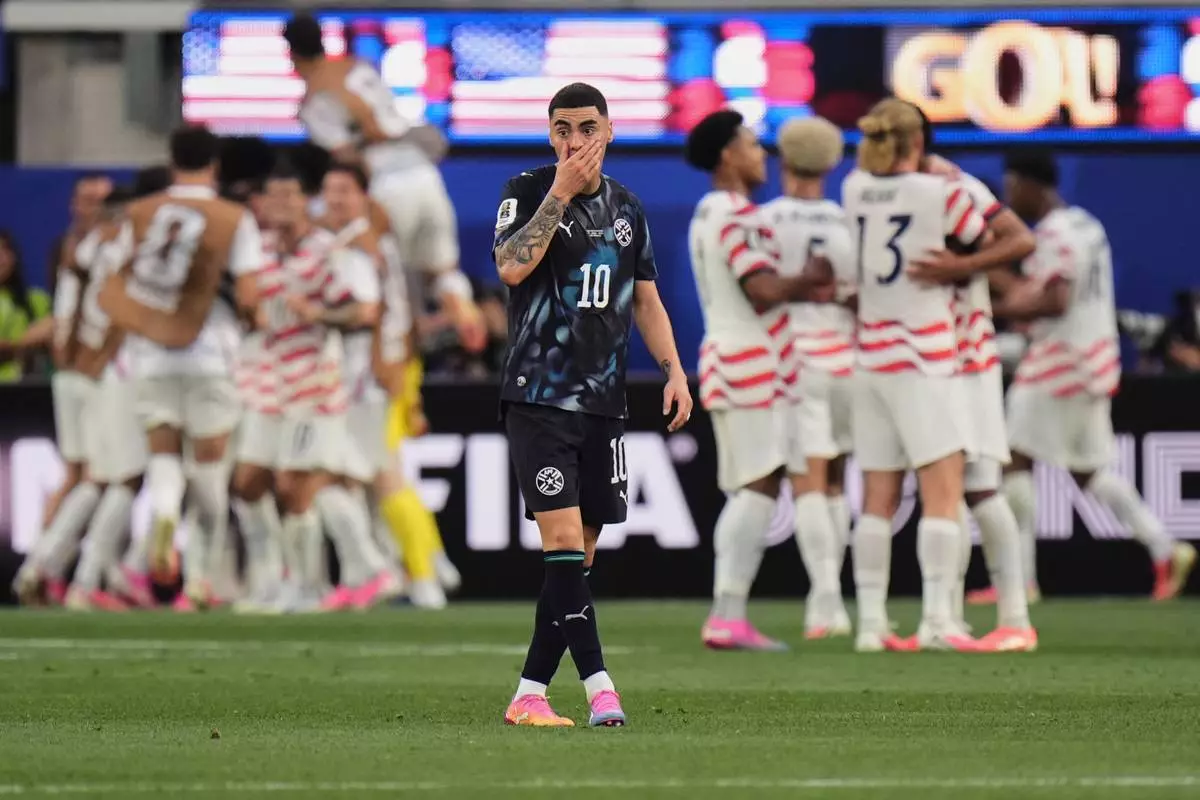 Paraguay's Miguel Almiron reacts after the United States scored a third goal during the World Cup Group D soccer match in Inglewood, Calif., near Los Angeles, Friday, June 12, 2026. (AP Photo/Jae C. Hong)