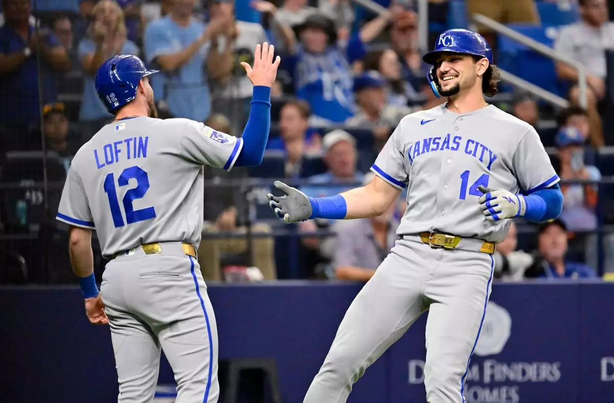 Kansas City Royals' Nick Loftin (12) and Jac Caglianone (14) celebrate Caglianone's two-run home run during the fifth inning of a baseball game against the Tampa Bay Rays Tuesday, June 23, 2026, in St. Petersburg, Fla. (AP Photo/Jason Behnken) CORRECTION: Corrects player at left to Nick Loftin, instead of Jac Caglianone.