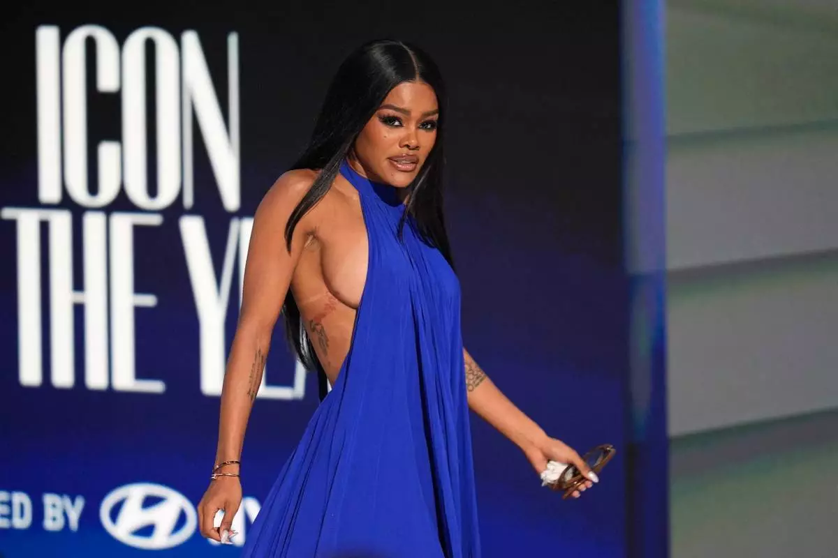 Teyana Taylor appears onstage to accept the Icon of the Year award during the BET Awards on Sunday, June 28, 2026, at the Peacock Theater in Los Angeles. (AP Photo/John Locher)