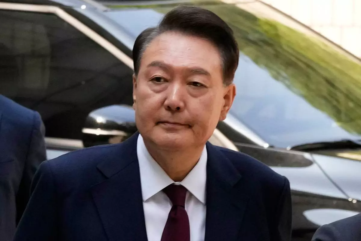 South Korea's ousted former President Yoon Suk Yeol arrives to attend his trial at the Seoul Central District Court in Seoul, South Korea, May 12, 2025. (AP Photo/Ahn Young-joon, Pool, File)