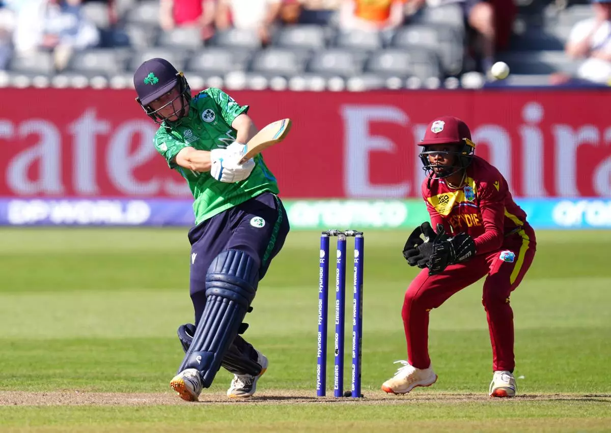 Ireland's Orla Prendergast, left, scores four runs to reach a half century during the Women's T20 World Cup cricket match between West Indies and Ireland, at Bristol County Ground, in Bristol, England, Saturday June 27, 2026. (David Davies/PA via AP)
