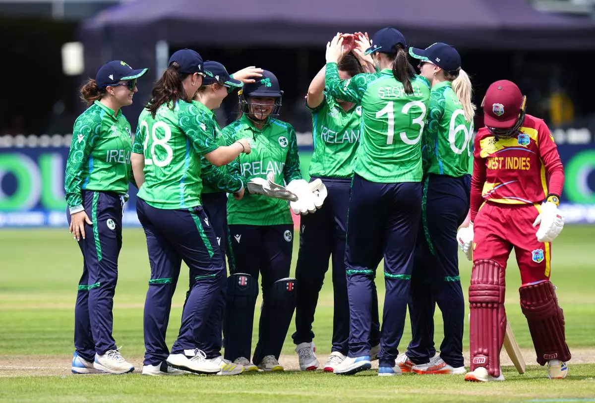 Ireland's Amy Hunter, center, celebrates with team-mates after catching out West Indies' Shemaine Campbelle, right, during the Women's T20 World Cup cricket match between West Indies and Ireland, at Bristol County Ground, in Bristol, England, Saturday June 27, 2026. (David Davies/PA via AP)