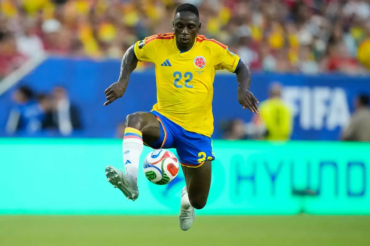 Colombia's Deiver Machado (22) attempts to control the ball during the World Cup Group K soccer match between Colombia and Portugal in Miami Gardens, Fla., Saturday, June 27, 2026. (AP Photo/Rebecca Blackwell)