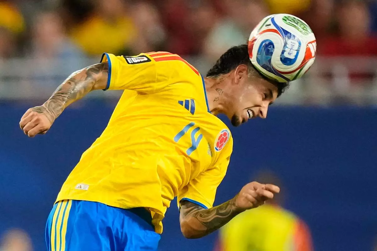 Colombia's Gustavo Puerta (14) heads the ball during the World Cup Group K soccer match between Colombia and Portugal in Miami Gardens, Fla., Saturday, June 27, 2026. (AP Photo/Rebecca Blackwell)