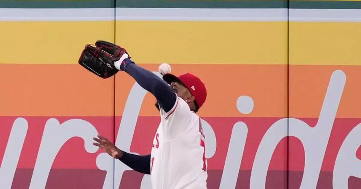 Rumfield gets gift homer when flyball bounces off Adell's head as Rockies top Angels 8-2