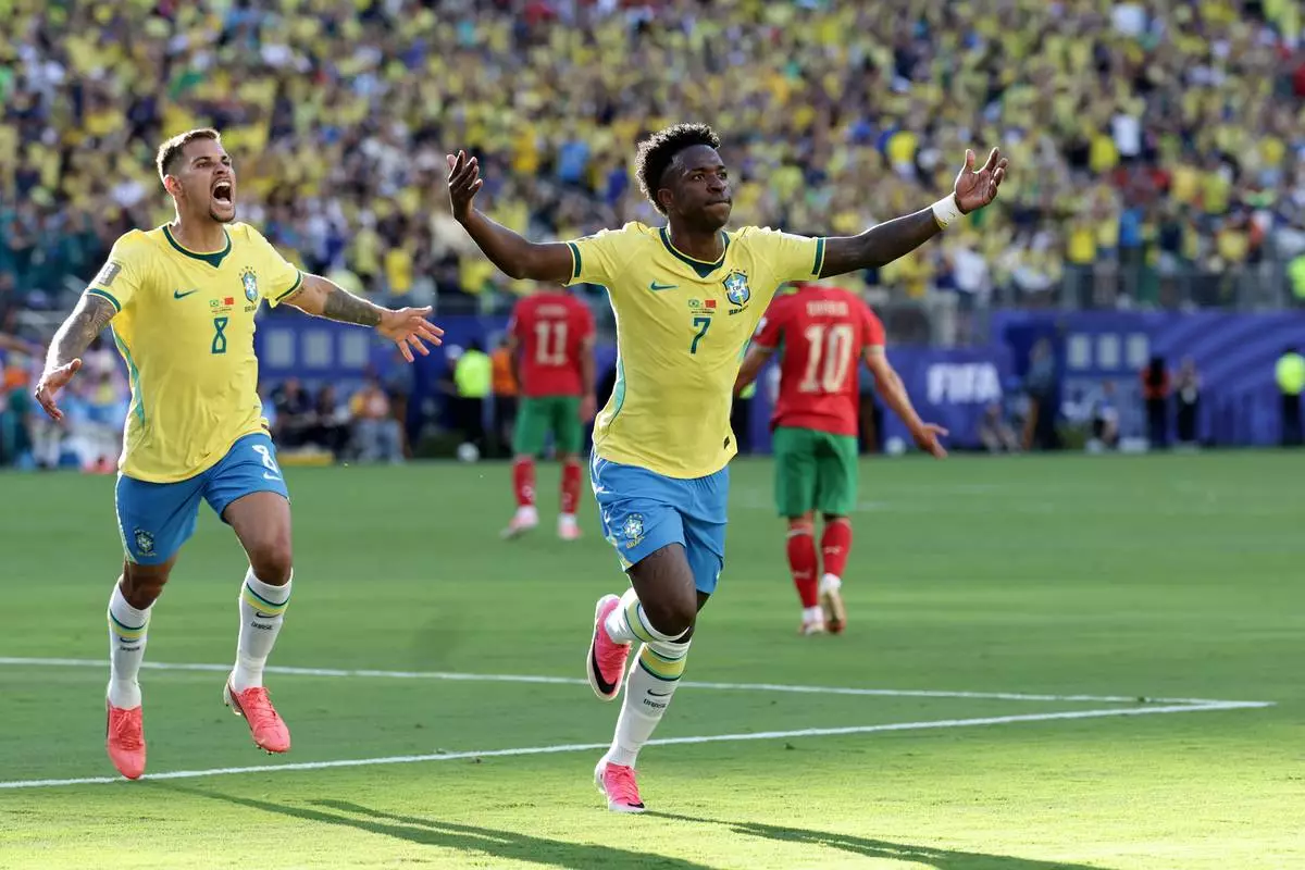 Brazil's Vinicius Junior (7) celebrates a goal in the first half during the World Cup Group C soccer match between Brazil and Morocco in East Rutherford, N.J., near New York, Saturday, June 13, 2026. (AP Photo/Adam Hunger)