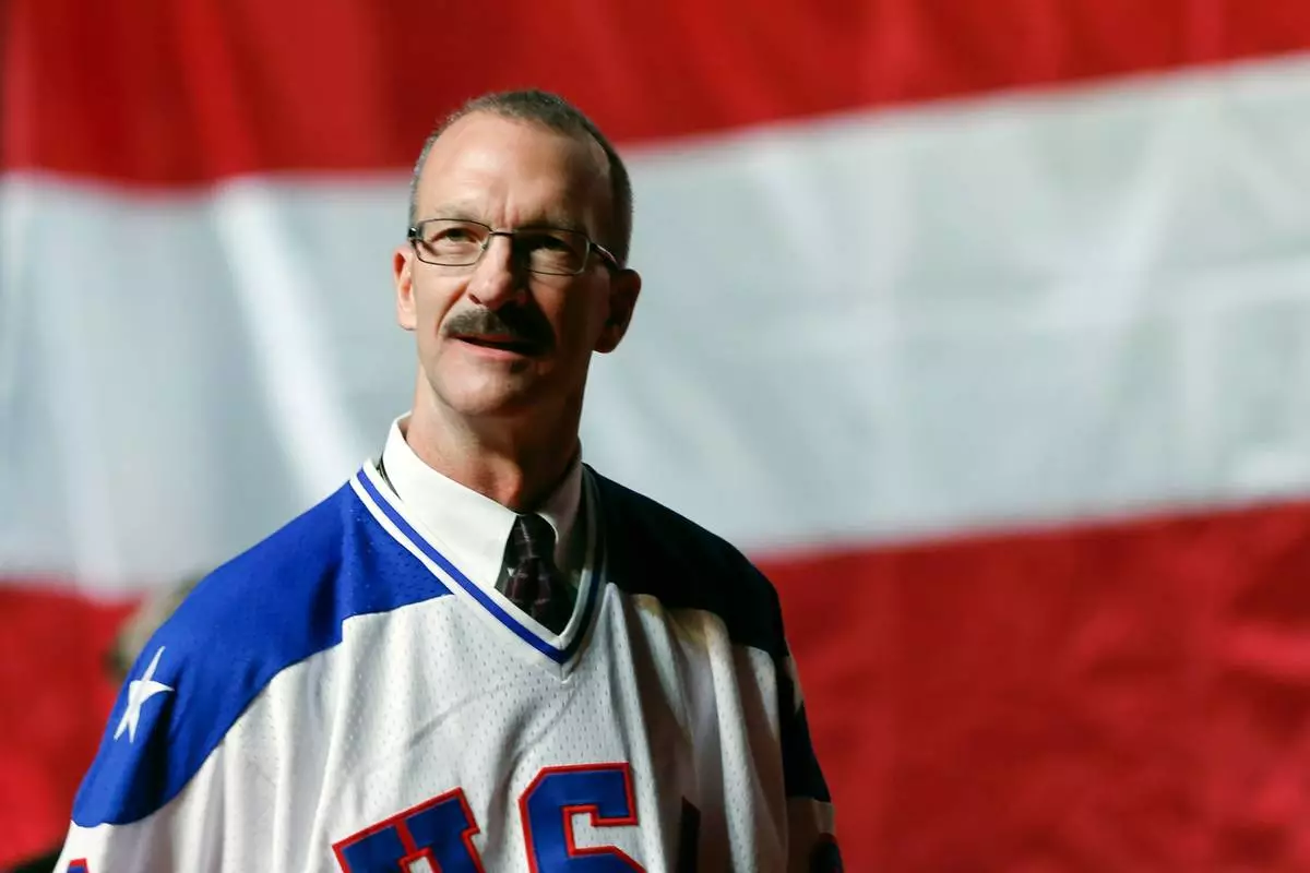 FILE - Ken Morrow of the 1980 U.S. ice hockey team walks on stage during a "Relive the Miracle" reunion at Herb Brooks Arena on Feb. 21, 2015, in Lake Placid, N.Y. (AP Photo/Mike Groll, File)