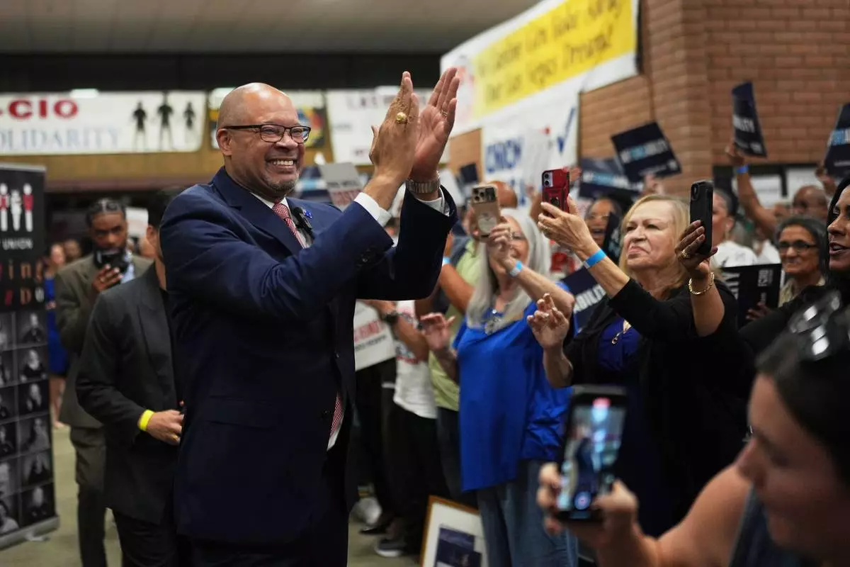 Gubernatorial candidate Aaron Ford, attorney general of Nevada, celebrates with attendees during a primary election night watch party after winning the Democratic nomination Tuesday, June 9, 2026, in Las Vegas. (AP Photo/Jae C. Hong)