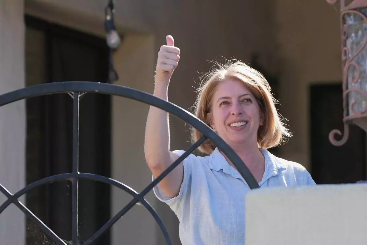 Marni von Wilpert, a Democratic candidate for California's 48th Congressional District, canvasses in a neighborhood Friday, May 29, 2026, in San Marcos, Calif. (AP Photo/Gregory Bull)