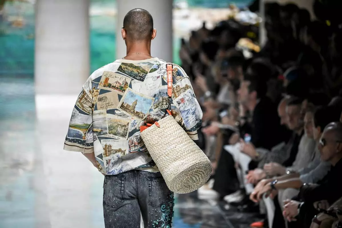 A model wears a creation from the Dolce & Gabbana Spring/Summer 2027 Men's collection presented in Milan, Italy, Saturday, June 20, 2026. (AP Photo/Nicola Marfisi)