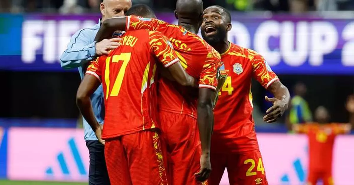 Congo rallies to a 3-1 win against Uzbekistan to seal place in the World Cup knockouts