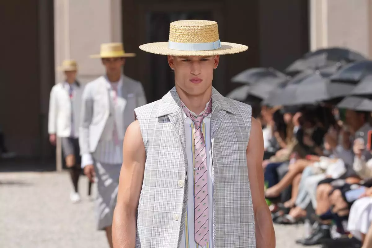 A model wears a creation of the Tom Browne Spring/Summer 2027 collection, presented in Milan, Italy, Monday, June 22, 2026. (AP Photo/Antonio Calanni)