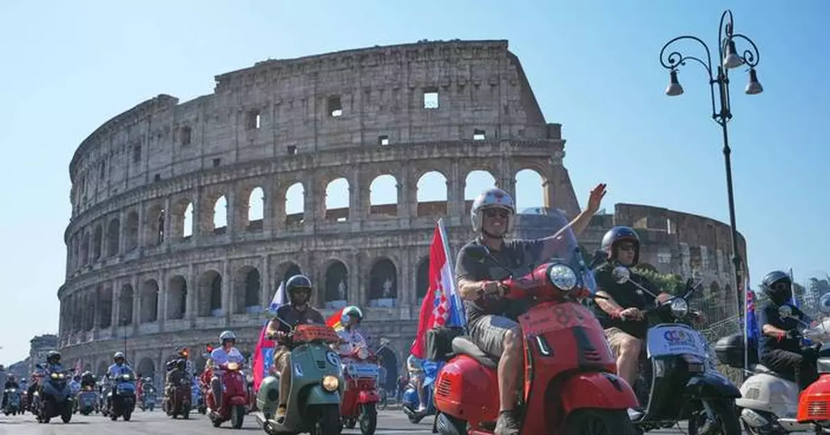 Thousands of Vespas swarm Rome’s historic center to mark iconic scooter’s 80th anniversary