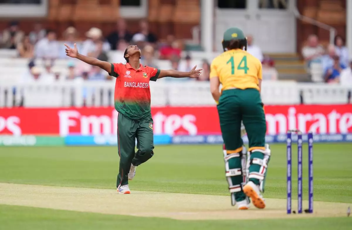 South Africa's Laura Wolvaardt is bowled by Bangladesh's Marufa Akter, during the Women's T20 World Cup cricket match between Bangladesh and South Africa at Lord's Cricket Ground, in London, Sunday June 28, 2026. (Adam Davy/PA via AP)